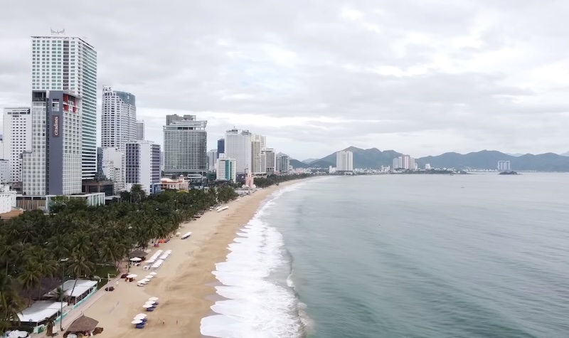 The long, sandy beach and skyline of Nha Trang