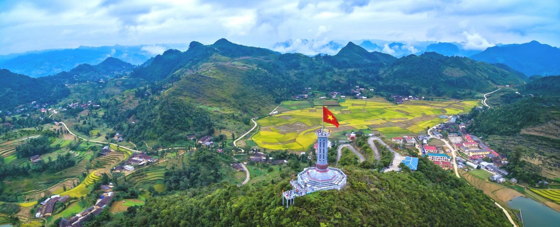 A motorbike navigating the dramatic, winding roads of the Ha Giang Loop