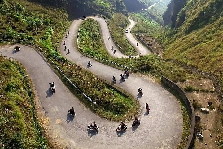 Motorbikes on a scenic road part of the Ha Giang Loop