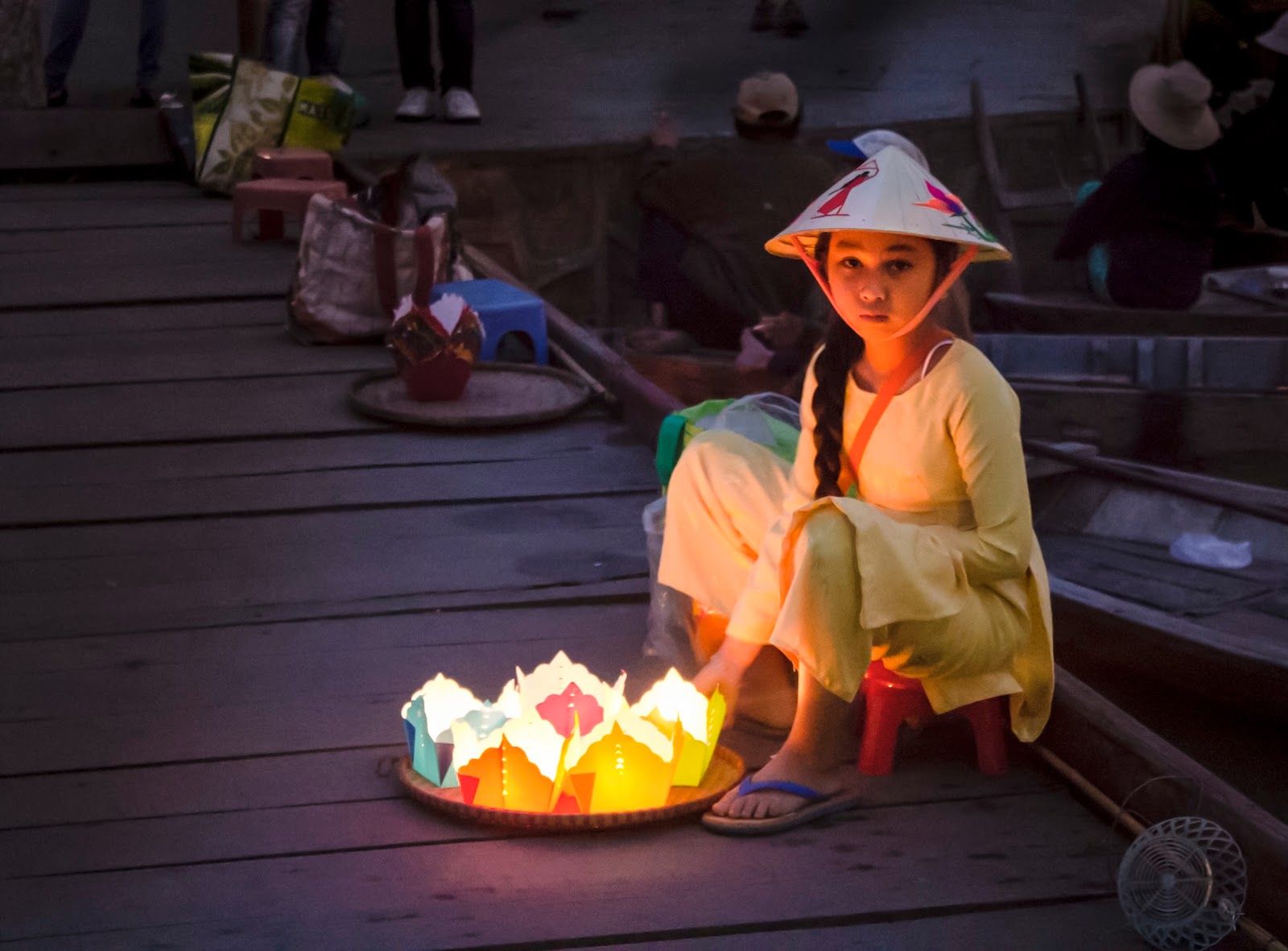 A woman making traditional silk lanterns in a workshop