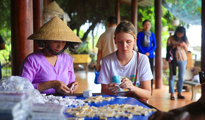 Women making traditional coconut candy in a workshop