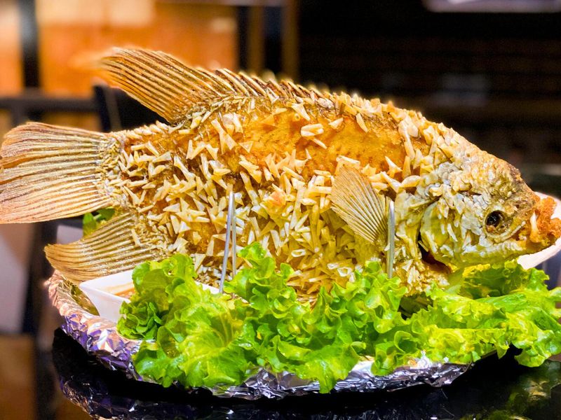 A platter of deep-fried Elephant Ear Fish, a Mekong Delta specialty