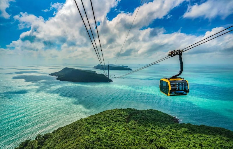A cable car gliding high above the sea and islands of An Thoi