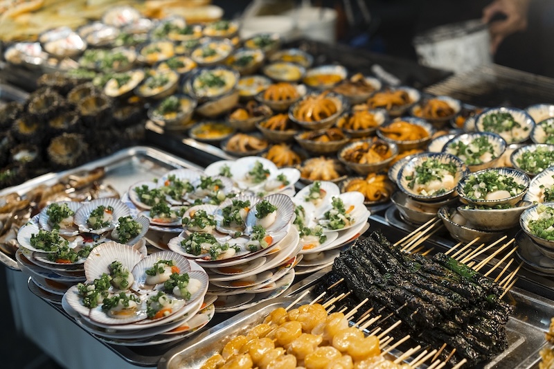A delicious spread of fresh grilled seafood like scallops and shrimp