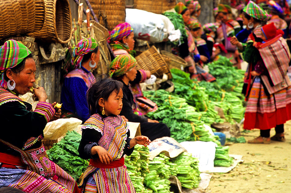 Women from different ethnic groups at a local Sapa market